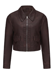 Detail of dark brown faux leather jacket featuring silver zipper and flap utility pockets