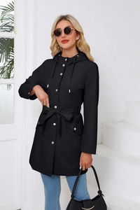 Detail of waterproof hooded trench coat with metal snap buttons and adjustable waist belt