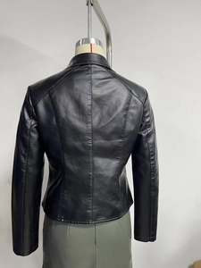 Back view of slim fit black faux leather jacket with center seam and collar detail