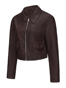 Detail of dark brown faux leather jacket featuring silver zipper and symmetrical flap pockets