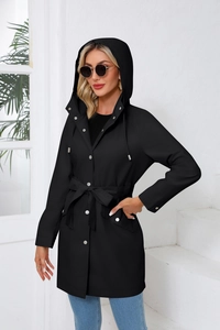 Detail of waterproof black hooded windbreaker with waist belt and silver metallic buttons