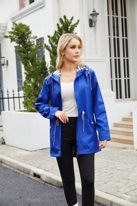 Detail of blue waterproof hooded raincoat with striped lining and white drawstrings
