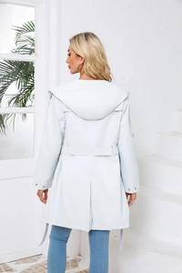 Detail view of the back of a hooded water-resistant trench coat with adjustable waist belt