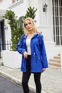 Detail of royal blue hooded raincoat featuring striped lining and adjustable drawstring waist