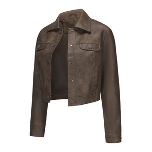 Close-up of a brown faux leather moto jacket with flap pockets and snap buttons