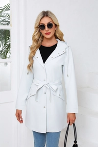 Close-up of light blue hooded trench coat with waist belt and silver snap buttons