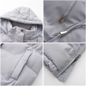 Detail view of the quilted stitching, metal zipper, and drawstring hood on a long vest