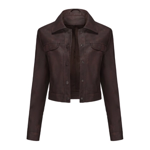 Detail view of cropped faux leather jacket with brown collar and multi-pockets