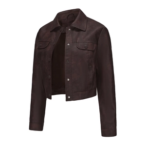Detail of dark brown faux leather jacket featuring metal snaps and chest flap pockets