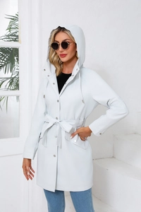 Detail view of light grey hooded trench coat with waist belt and button closure