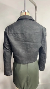Back view of a black faux leather jacket featuring segment stitching and hem belt detail
