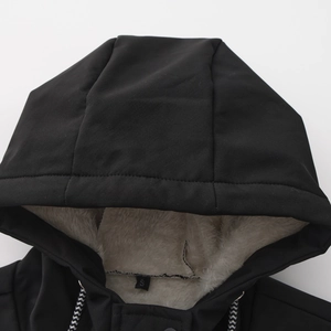 Detail of black windproof hooded jacket with warm off-white fleece lining and drawstring