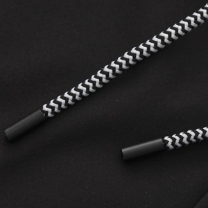 Detail of the high-quality black and white woven drawstring with matte end tips