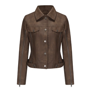 Detail of dark brown faux leather jacket featuring decorative arm zippers and lapels