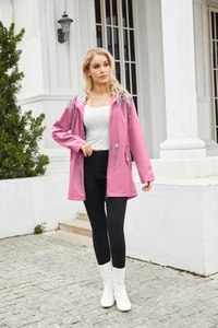 Detail of pink hooded waterproof raincoat with zipper and adjustable drawstring hood