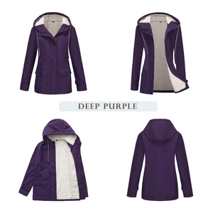 Detail view of deep purple hooded windbreaker with warm grey fleece lining and secure pockets