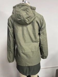 Detail view of olive green hooded jacket back with horizontal seam and elasticated cuffs