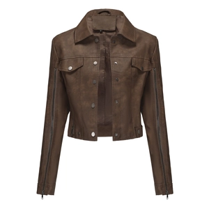 Detail view of brown biker jacket with metallic zippers and front flap pockets on sleeves
