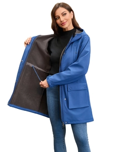 Detail of blue windproof jacket showing warm grey fleece lining and waist drawstring
