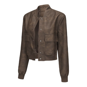 Detailed view of brown faux leather jacket with ribbed cuffs and snap button closure