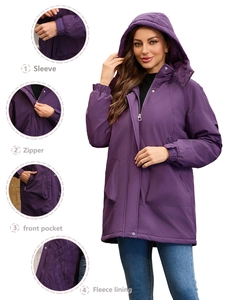 Detail view of purple women's hiking parka showing warm fleece lining and sturdy zipper