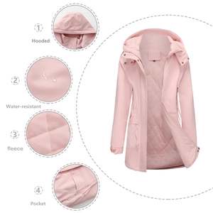 Detail view of water-resistant pink parka with hooded design and warm fleece lining