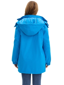 Back view of a bright blue windproof hiking jacket with a warm quilted lining and hood