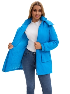 Detail of light blue winter parka featuring a quilted lining and double closure system