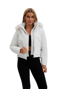 Detail view of the white hooded padded jacket featuring thick faux fur collar and silver zipper