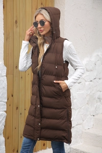 Detail view of the deep brown quilted long vest showing side zipper and puffer texture