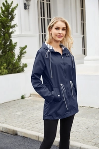 Detail of navy blue hooded raincoat featuring striped lining and drawstring waist design