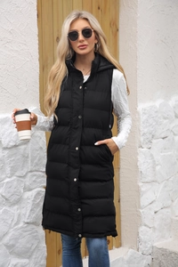 Detail of black longline hooded puffer vest with metal snap buttons and quilted texture