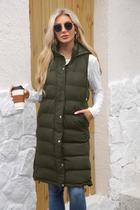 Detail view of long hooded puffer vest in dark olive green featuring quilted texture and snaps