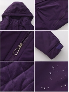 Detail view of purple waterproof women's hiking jacket features zipper and hood