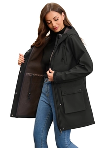 Detail of waterproof black raincoat with warm tan fleece lining and drawstring waist