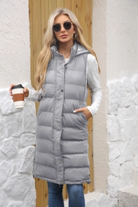 Detail of light gray long hooded vest featuring side zipper slits and metallic buttons