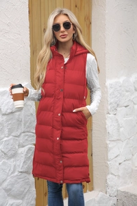 Close-up of red hooded long vest with horizontal quilting and silver metal snap buttons