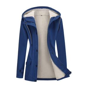 Close-up of women's navy blue windbreaker with warm cream fleece lining and zip closure