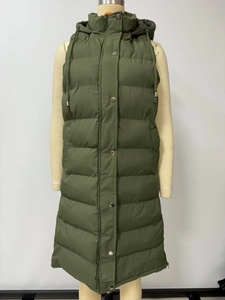 Detail view of olive green quilted long hooded vest with snap buttons and side pockets