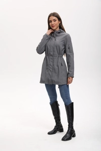 Detail view of the drawstring waist and functional zipper pocket on the grey softshell jacket
