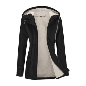 Detail of waterproof black parka featuring warm white faux lamb wool fleece lining