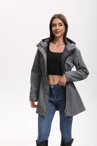 Detail of gray outdoor jacket featuring a hooded design and tactical sleeve zip pocket