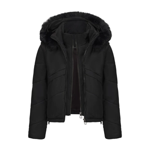 Detailed close-up of a black quilted puffer jacket featuring a faux fur hood and zipper
