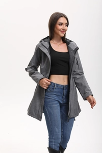 Detail of dark grey hooded jacket featuring multi-pockets and adjustable waist drawstring