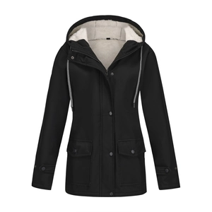 Detail of waterproof black windbreaker with white faux fur lining and dual closure system