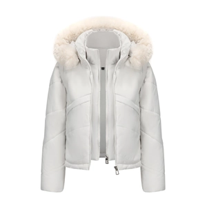 Detail of white puffer coat with large fur hood, zipper, and quilted texture design
