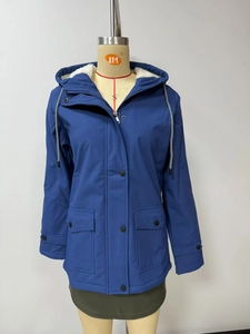 Close-up of women's hooded parka jacket with warm faux shearling lining and drawstring