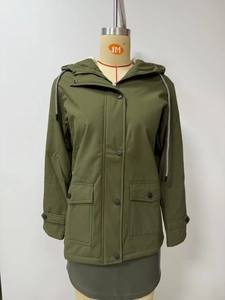 Detail of army green hooded parka with warm white fleece lining and dual zipper closure