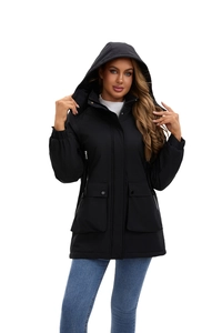 Detail of a black hooded parka jacket featuring large flap pockets and windproof material