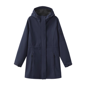 Detail of navy blue waterproof jacket featuring functional zipper pockets and Velcro cuffs